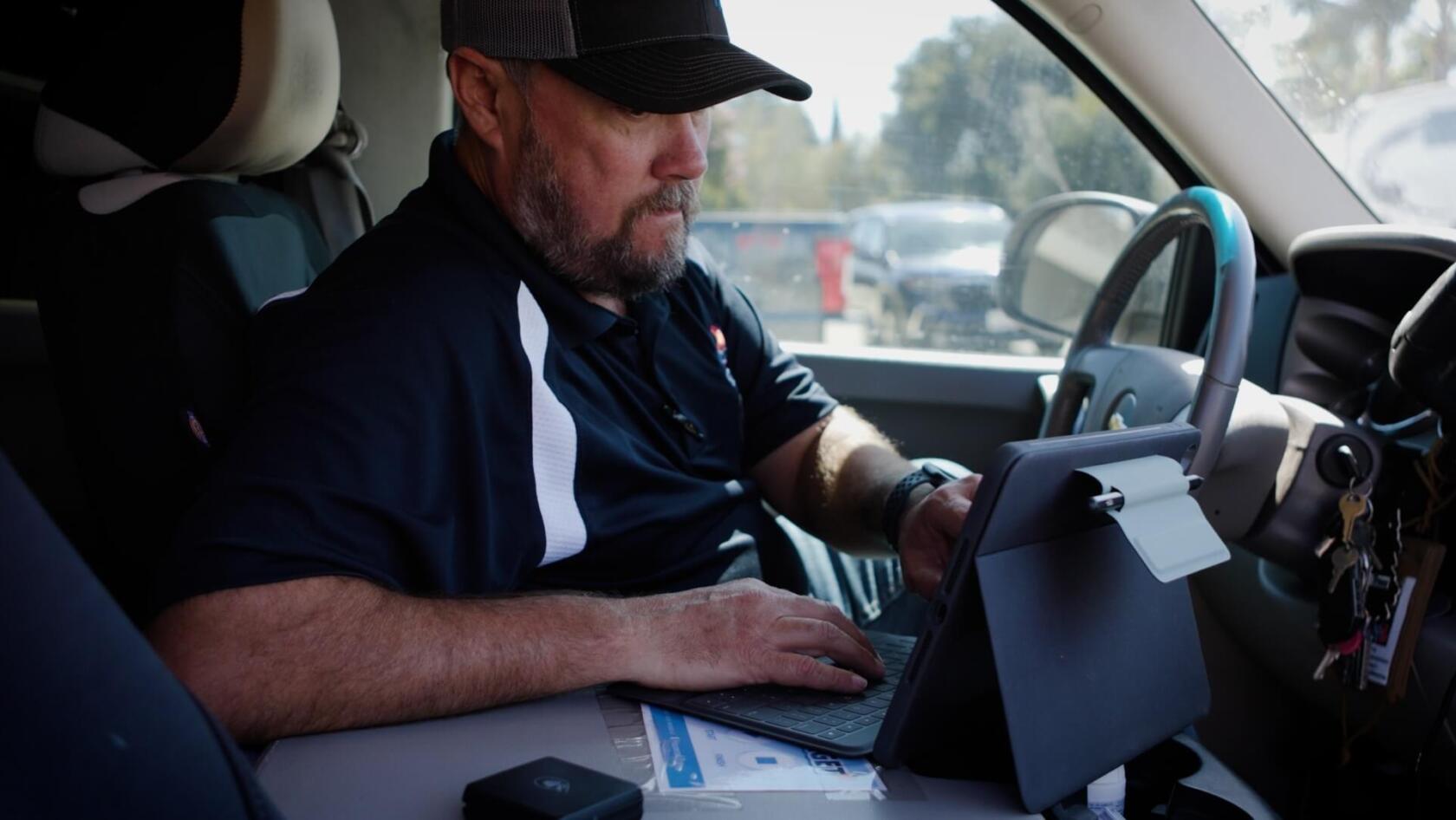 contractor using Housecall Pro app for scheduling jobs