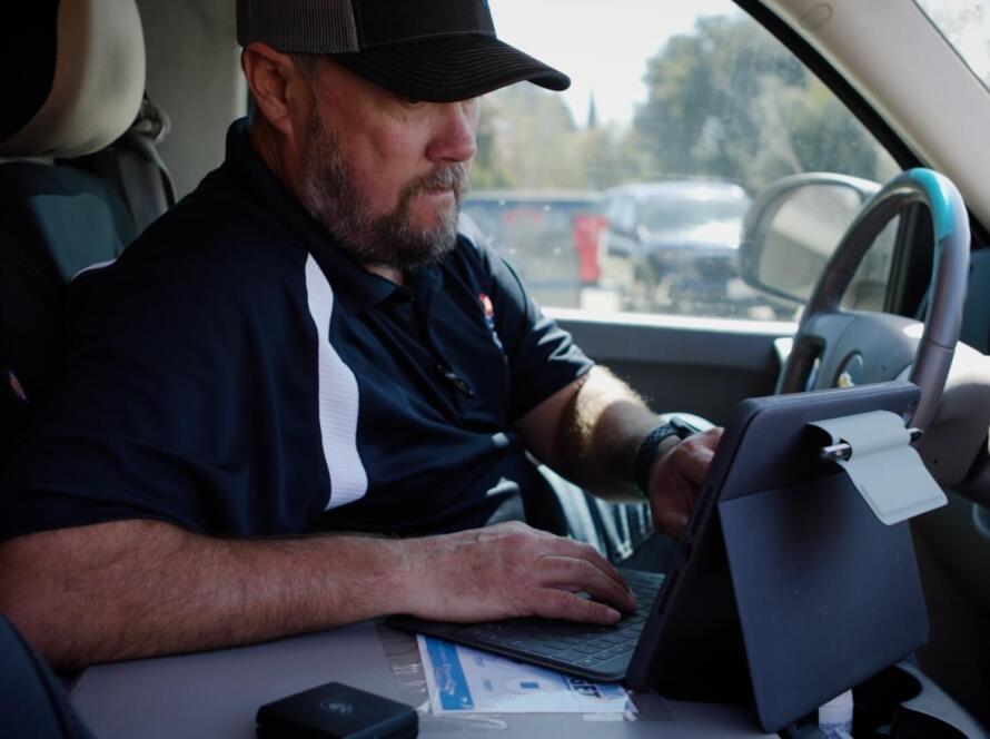 contractor using Housecall Pro app for scheduling jobs