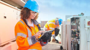 Field service technician using mobile software for scheduling, dispatch, and service operations
